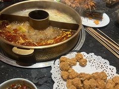 -明何记涮牛肚(品牌首店隋唐植物园南门古城路店)