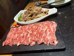 -明何记涮牛肚(品牌首店隋唐植物园南门古城路店)