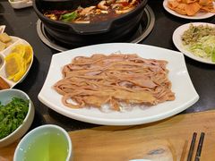 -明何记涮牛肚(品牌首店隋唐植物园南门古城路店)