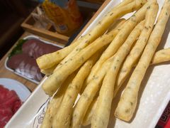 -明何记涮牛肚(品牌首店隋唐植物园南门古城路店)