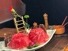 -明何记涮牛肚(品牌首店隋唐植物园南门古城路店)