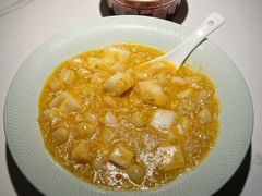 蟹黄年糕炒鲜贝-小峰饭店·35年锡帮菜