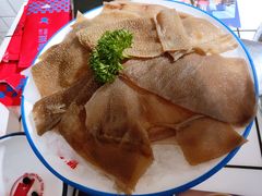 屠场鲜毛肚-喜悦小串丹东小黄牛海鲜烧烤大排档(民主广场店)