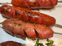烤自制肠-街角等你.大连海鲜烧烤.经典铁板海鲜串(西安路店)