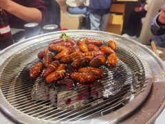 烤蚕蛹-围炉肉舍•炭烤活鳗•丹东海鲜烤肉(步行街店)