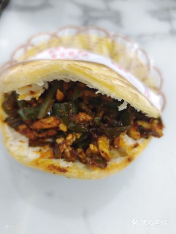 西安的“孜然炒肉（夹馍）”