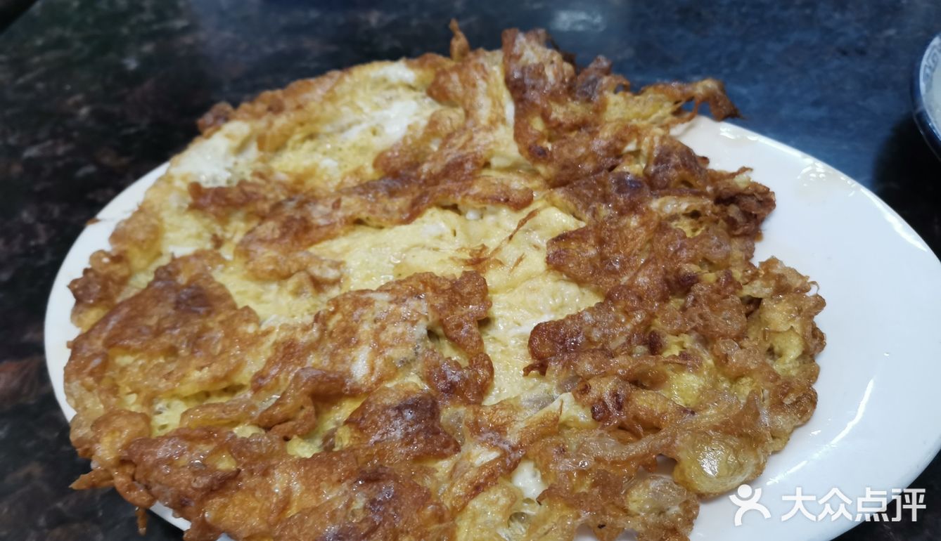 店里还有特制酱料蘸粥里的海鲜