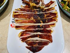 烤鱿鱼-金太阳海鲜烧烤·本地人餐厅(星海公园店)