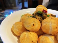 酸菜炒汤圆-蜗牛小馆醉乡民谣云南菜(惠新西里店)