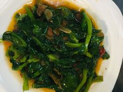 酸腌菜炒豌豆尖-火燒雲傣家菜(鼓楼店)