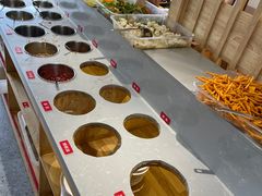 自助调料区-明何记涮牛肚(品牌首店隋唐植物园南门古城路店)