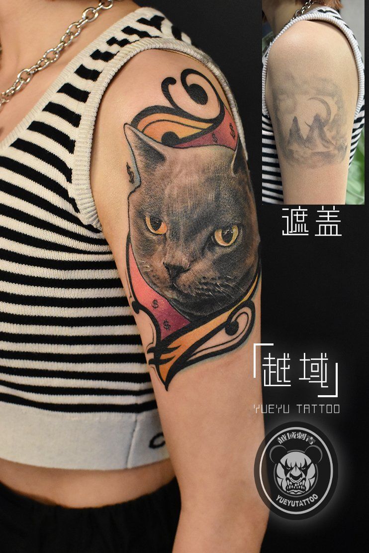 手臂猫咪纹身