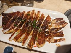 烤鱿鱼-金太阳海鲜烧烤·本地人餐厅(星海公园店)