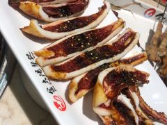 烤鱿鱼-金太阳海鲜烧烤·本地人餐厅(星海公园店)