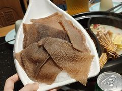 -明何记涮牛肚(品牌首店隋唐植物园南门古城路店)