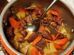西红柿炖牛腩-关东小磨东北菜(上海长风大悦城店)