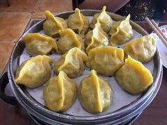 玉米面酸菜蒸饺-那家老院子东北菜·饺子·小鸡炖蘑菇(艳华街店)