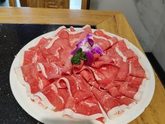-明何记涮牛肚(品牌首店隋唐植物园南门古城路店)