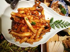 梭子蟹炒年糕-卯时·龙光雅宴·精致锡帮菜(惠山古镇店)