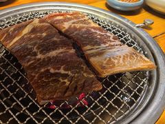草家秘制牛小排-草家酱蟹炭火烤肉店(珲春南路一店)