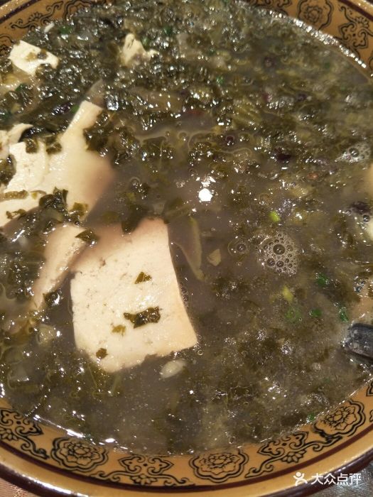 酸汤煮石灰豆腐