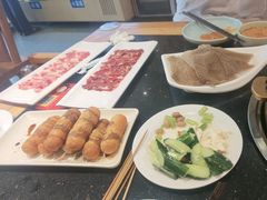 -明何记涮牛肚(品牌首店隋唐植物园南门古城路店)