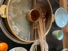 -明何记涮牛肚(品牌首店隋唐植物园南门古城路店)