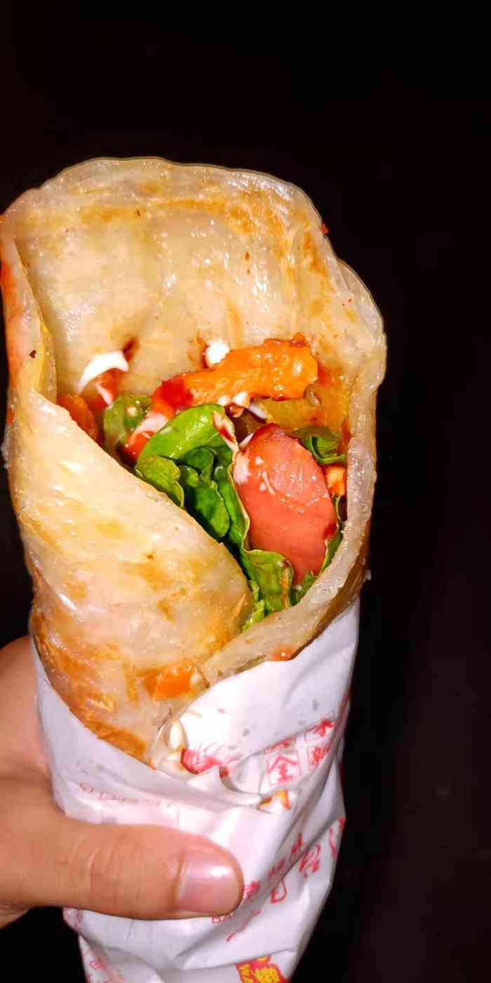 山东杂粮煎饼孙记烤冷面手抓饼(海达路店)-"一家很小的店铺,夫妻俩和