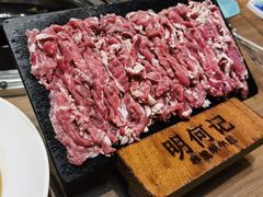 -明何记涮牛肚(品牌首店隋唐植物园南门古城路店)