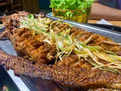 烤鲶鱼-明何记涮牛肚(品牌首店隋唐植物园南门古城路店)