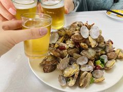 辣炒蛤蜊-1910老鲁味海鲜·戳子肉·青岛菜(金沙滩店)