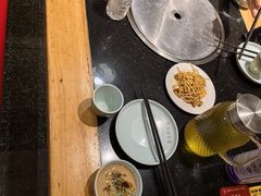 -明何记涮牛肚(品牌首店隋唐植物园南门古城路店)