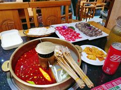 -明何记涮牛肚(品牌首店隋唐植物园南门古城路店)