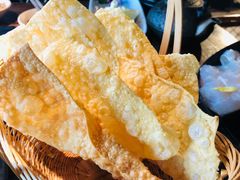 -老牌坊云南鱼豆花火锅(哈西万达店)