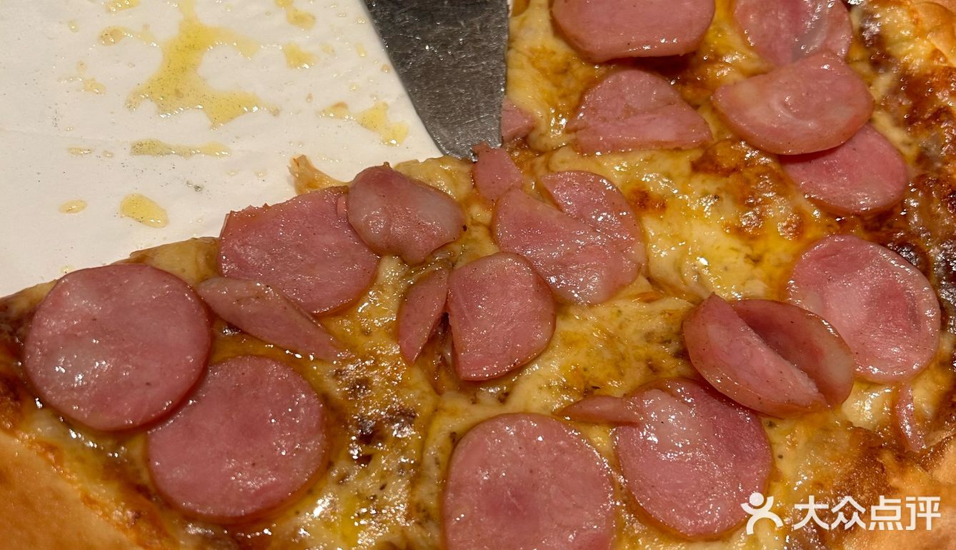 切一块西冷蘸油爆虾的蒜油，再卷上一叉子意面