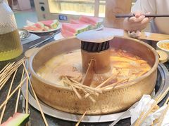 -明何记涮牛肚(品牌首店隋唐植物园南门古城路店)