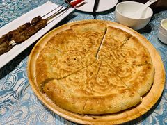 馕坑芝麻馕-巴扎美食·新疆菜·西域歌舞表演餐厅(新疆大厦店)