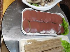 -明何记涮牛肚(品牌首店隋唐植物园南门古城路店)