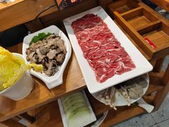 -明何记涮牛肚(品牌首店隋唐植物园南门古城路店)