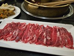 -明何记涮牛肚(品牌首店隋唐植物园南门古城路店)