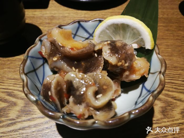 岩居酒屋炭烧玉螺图片