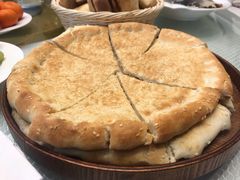 馕坑芝麻馕-巴扎美食·新疆菜·西域歌舞表演餐厅(新疆大厦店)