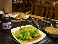 -明何记涮牛肚(品牌首店隋唐植物园南门古城路店)