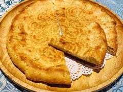 馕坑芝麻馕-巴扎美食·新疆菜·西域歌舞表演餐厅(新疆大厦店)