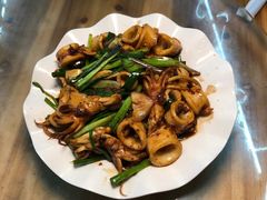 葱爆鱿鱼筒-明记海鲜大排档(巽寮湾店)