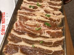 草家特色秘制牛排-草家酱蟹炭火烤肉店(珲春南路一店)