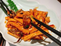 梭子蟹炒年糕-卯时·龙光雅宴·精致锡帮菜(惠山古镇店)