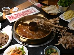 -明何记涮牛肚(品牌首店隋唐植物园南门古城路店)