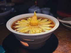 陈年花雕煮花螺-山塘渡·苏式园林餐厅