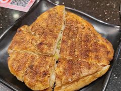 -明何记涮牛肚(品牌首店隋唐植物园南门古城路店)